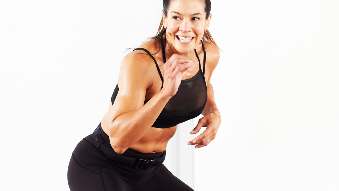 an energized woman performs an exercise move