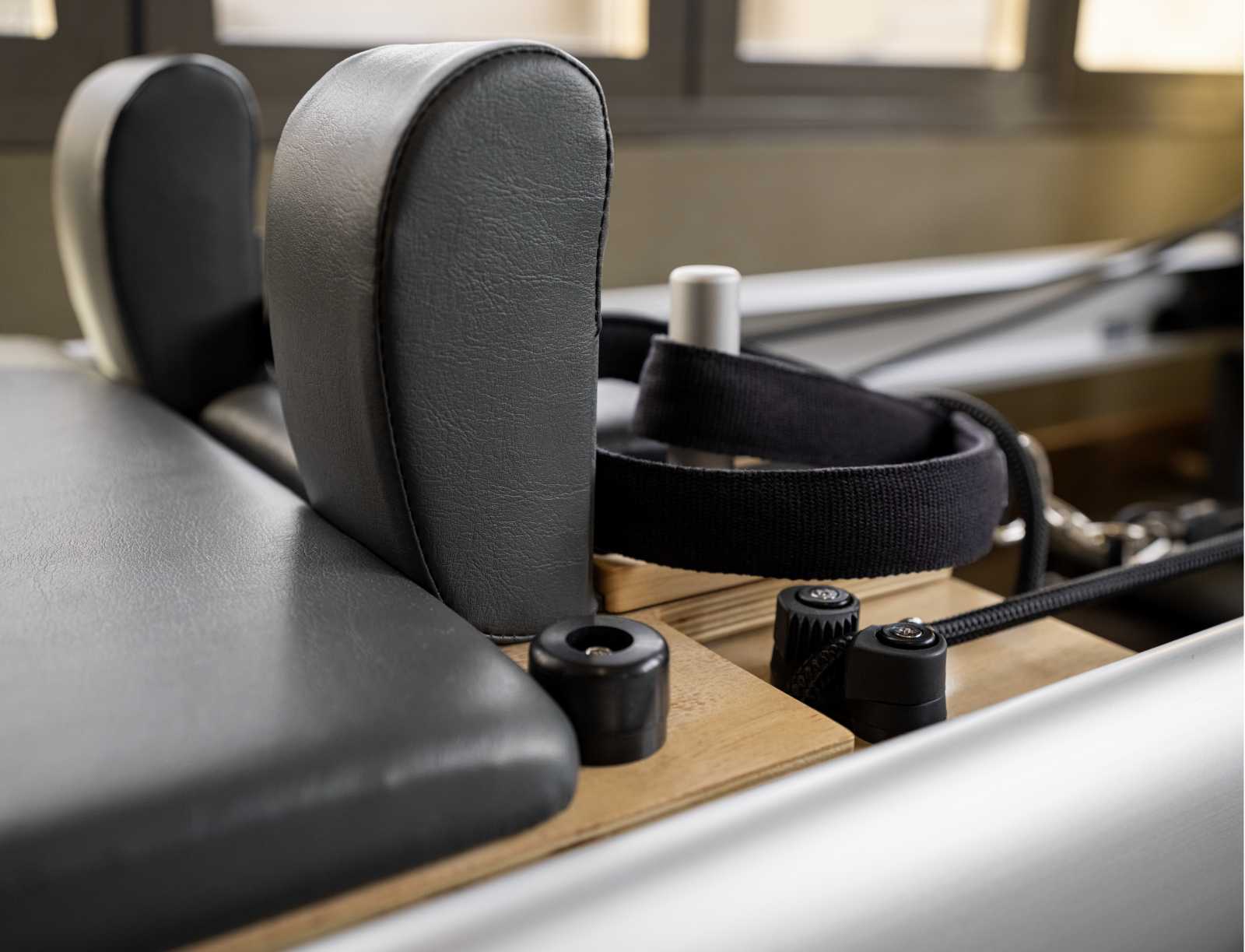 close up of the padded head rest of a pilates reformer machine