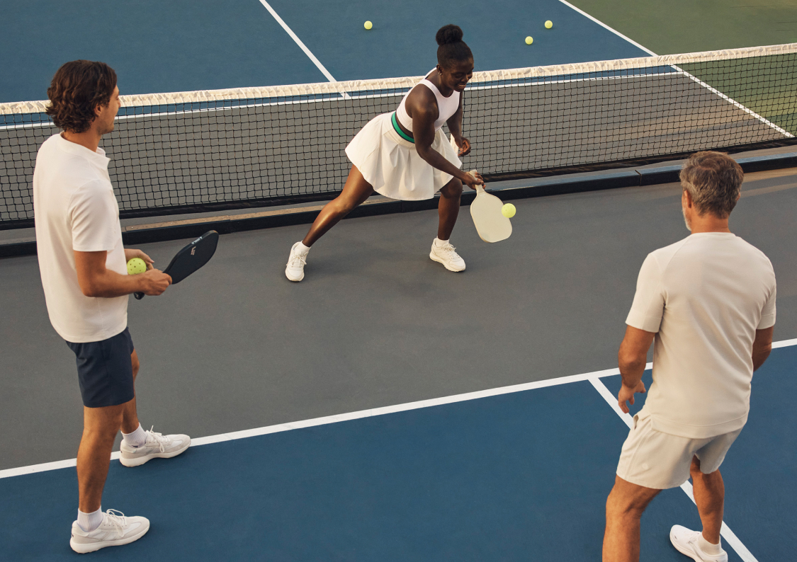 a woman going after a pickleball