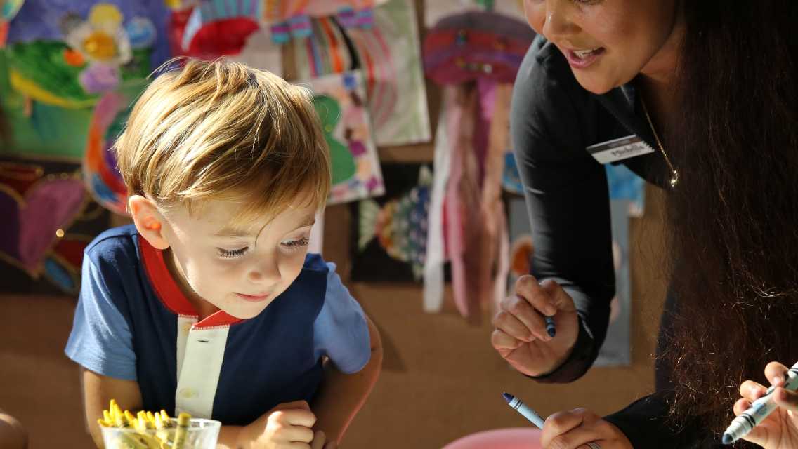 young boy coloring