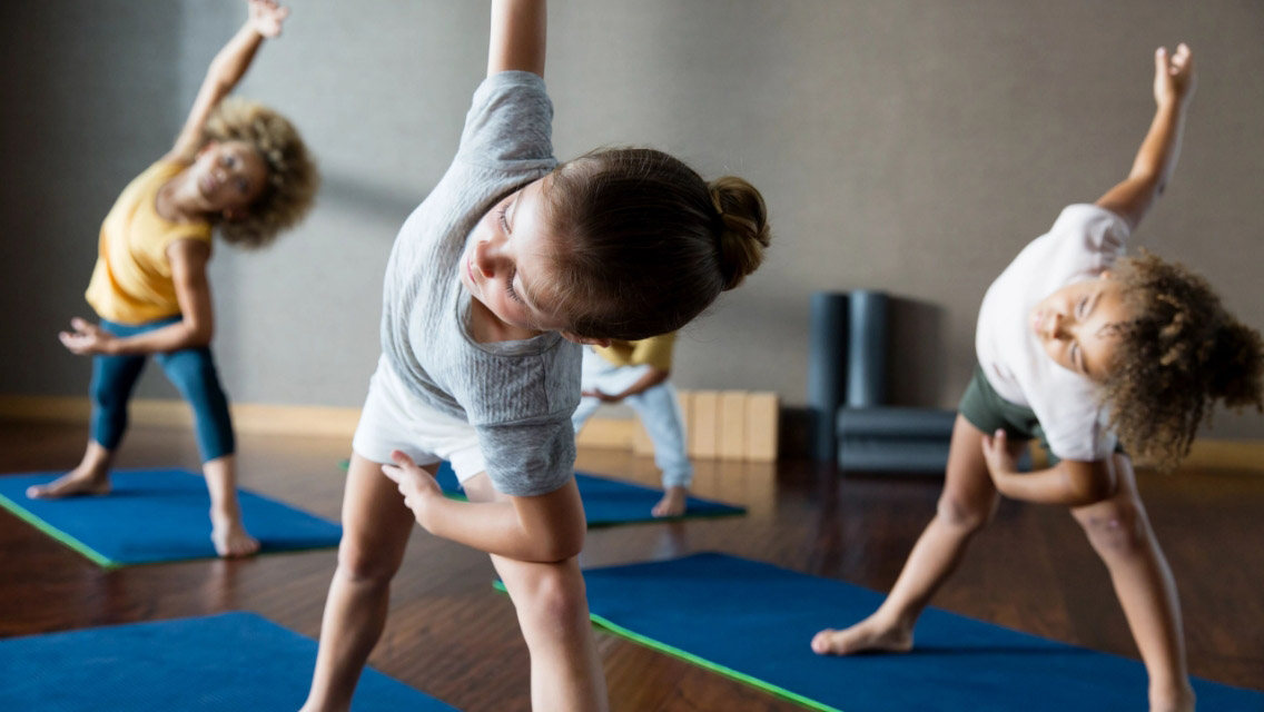 children doing yoga together, child practicing martial arts, child with gymnastic rings