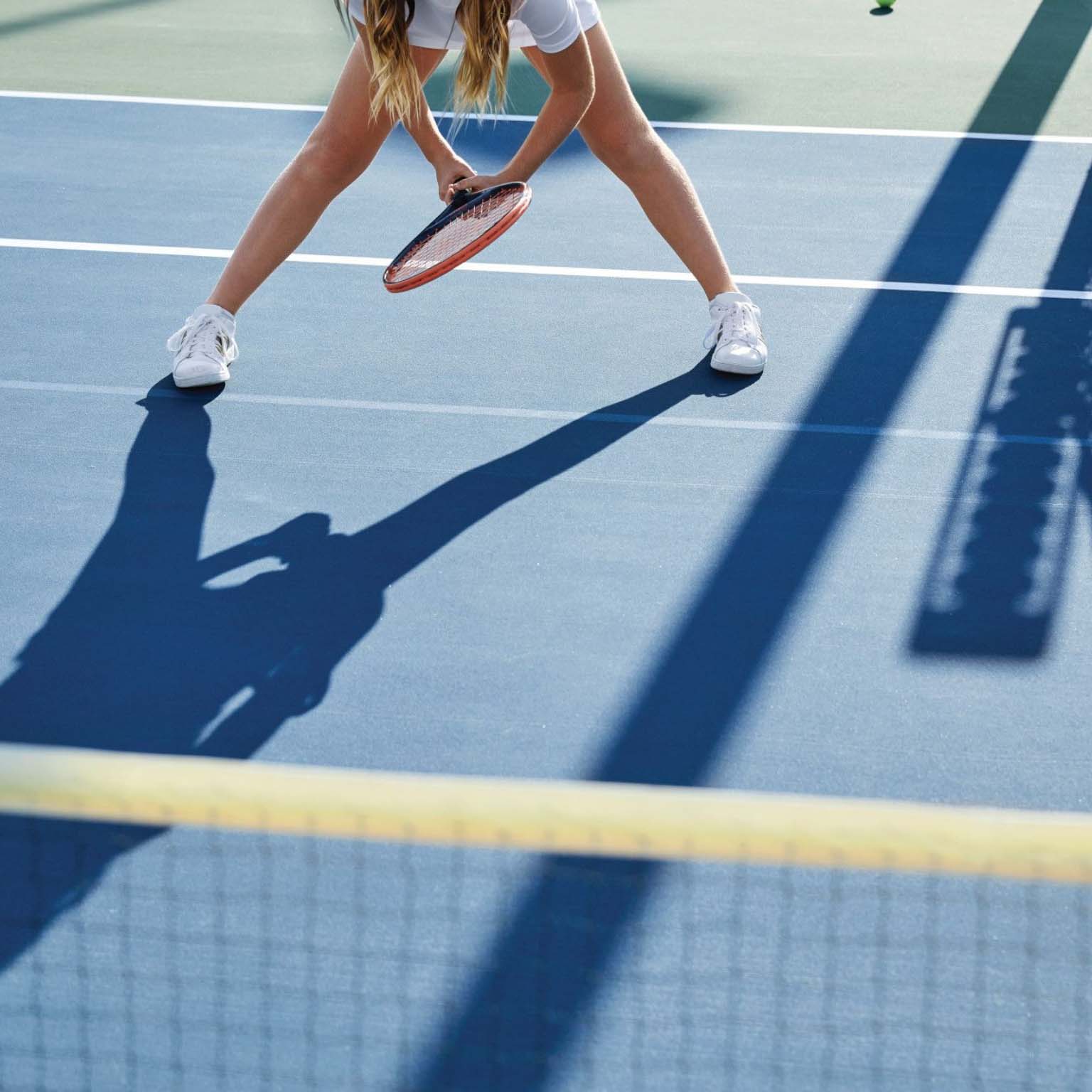 girl preparing for a tennis match