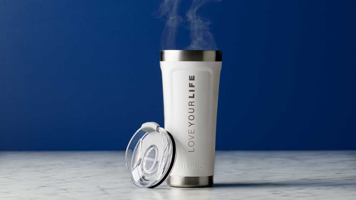 white Love Your Life tumbler with steaming hot coffee and lid