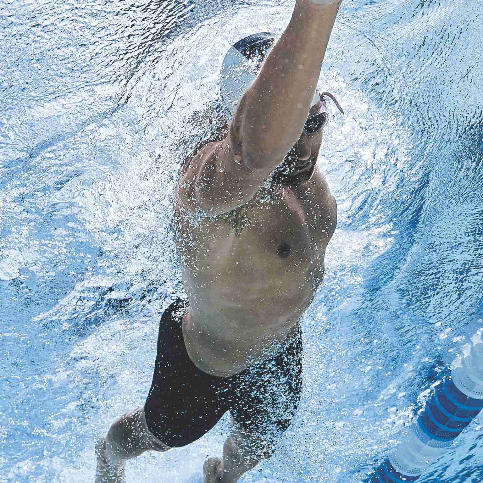 A man swims laps in the Life Time lap pool.