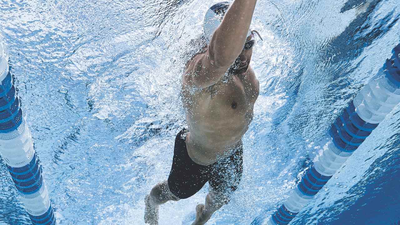 A man swims laps in the Life Time lap pool.