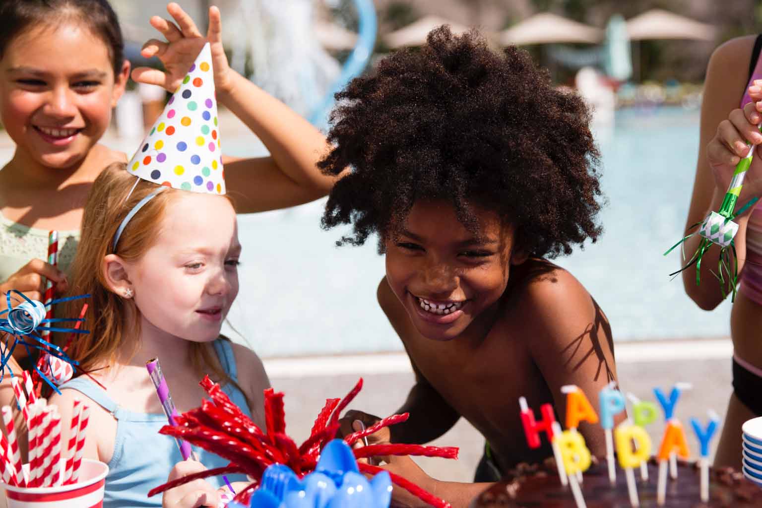 a group of young girls celebrating a birthday party