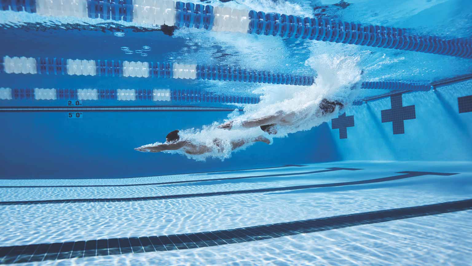 Guy diving into a swimming pool 