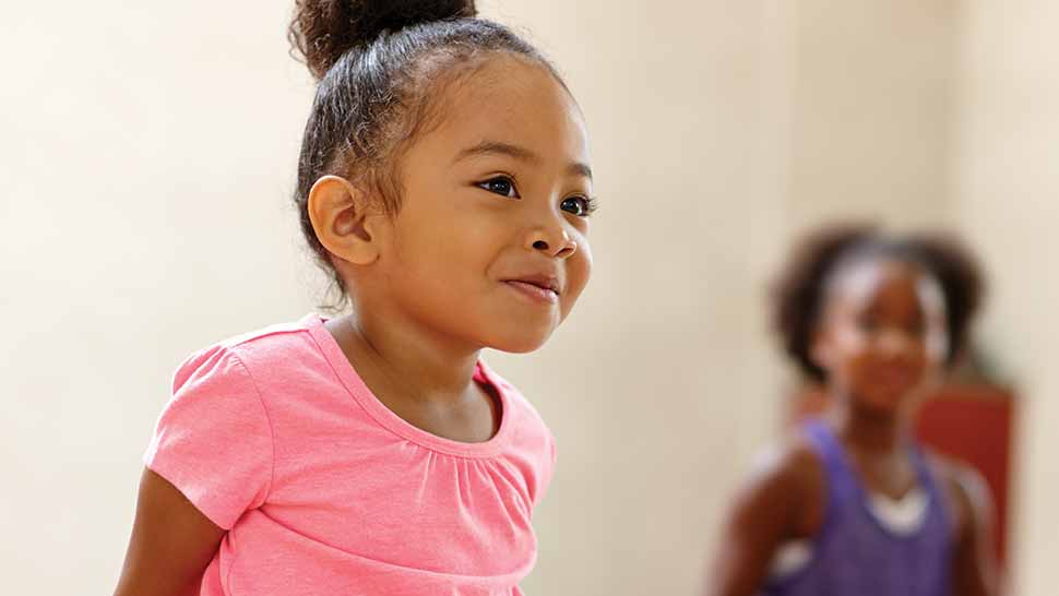 Girl smiling in after school program