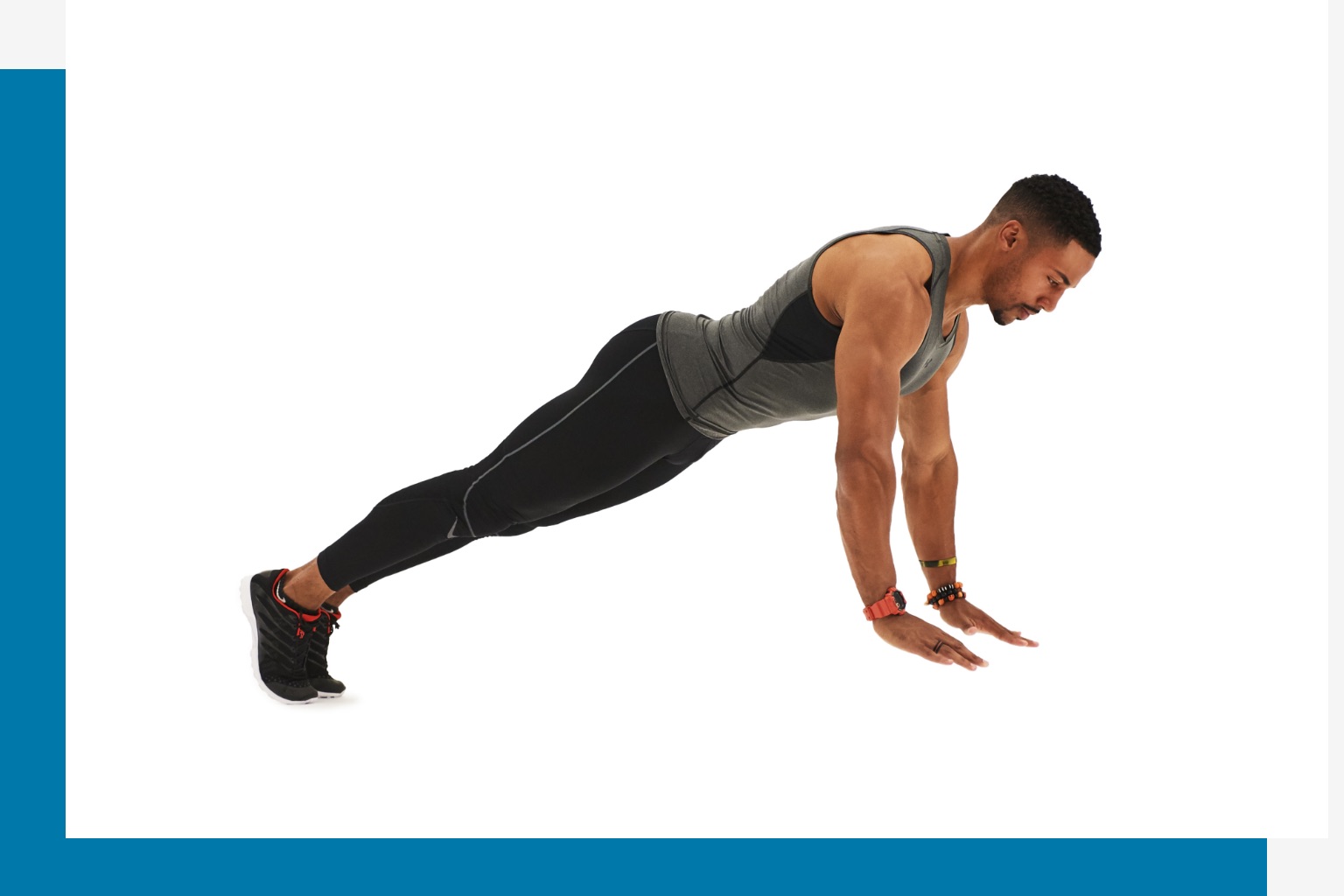 Man holding a straight arm plank. 