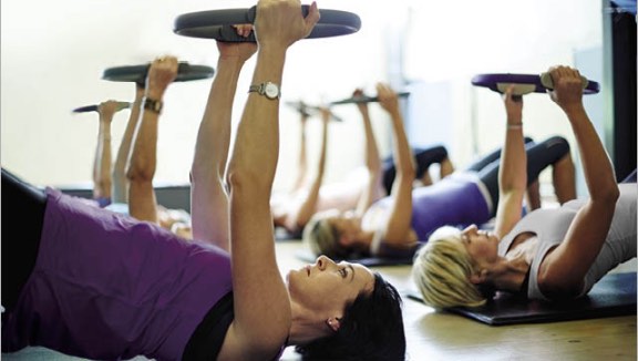 Group of people participating in a Pilates class at Life Time