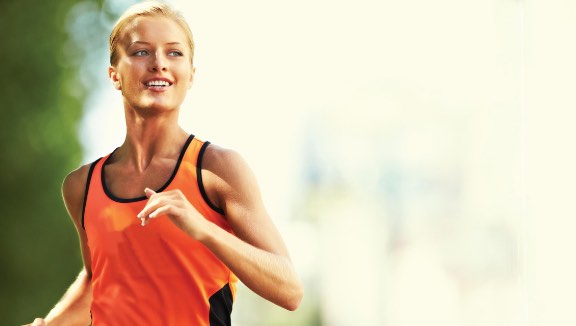 Woman running on an outdoor trail