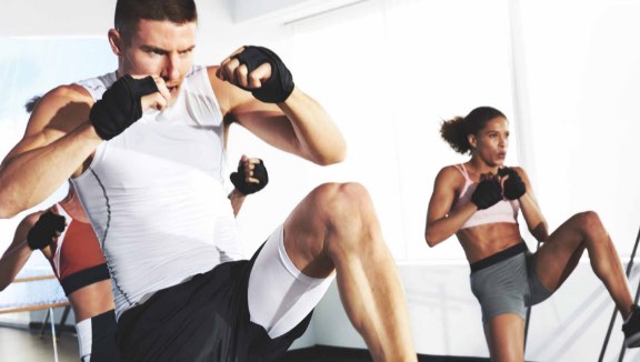 Group of people kickboxing in a STRIKE class at Life Time