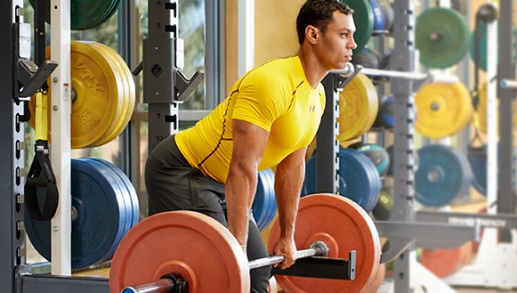 Man doing a deadlift with a heavy barbell