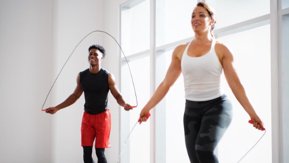 Two people jumping rope in a Ringside class at Life Time