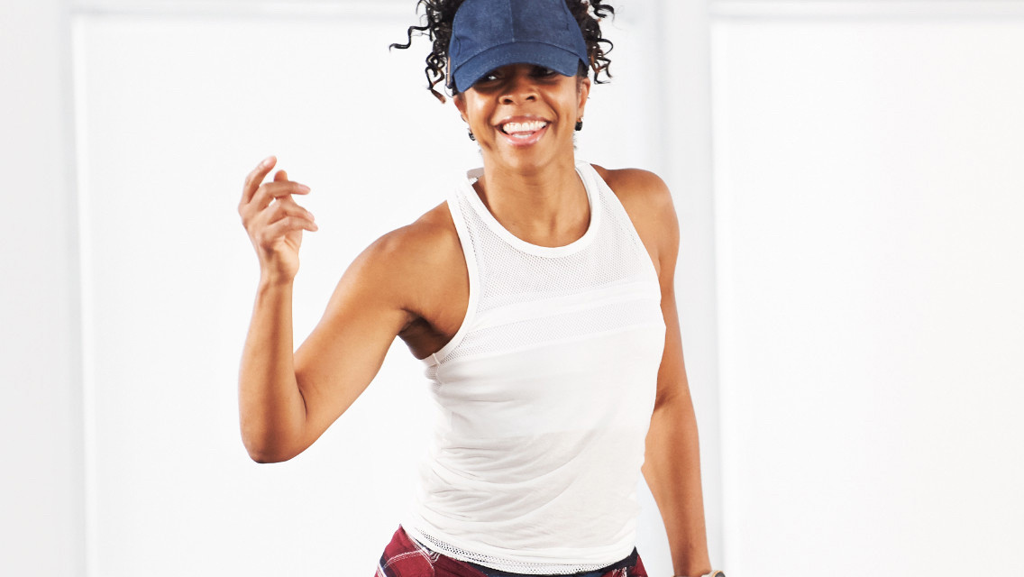 Woman taking a cardio hip hop class with Life Time On Demand