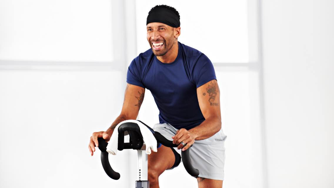 A man working out on a stationary bike