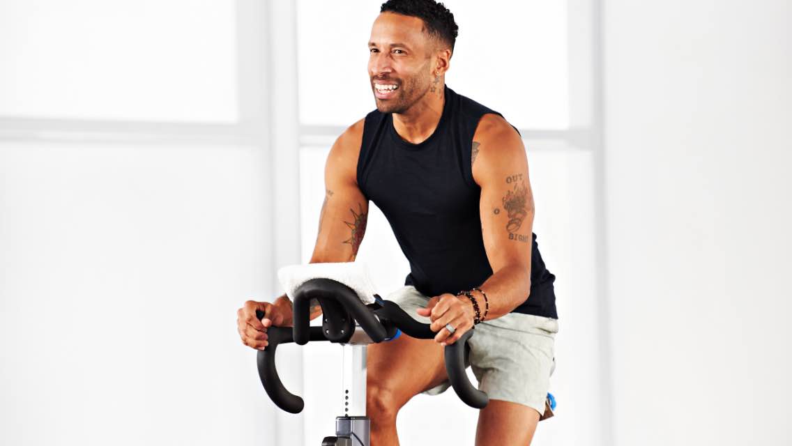 A man working out on a stationary bike