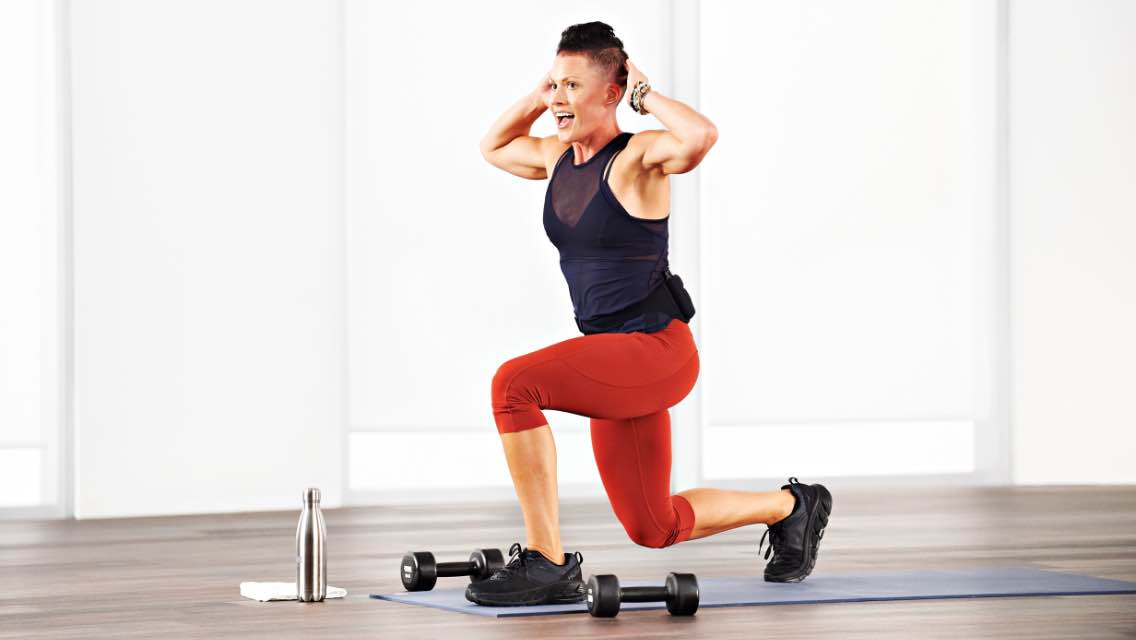 a woman doing lunges at home with Life Time Classes On Demand
