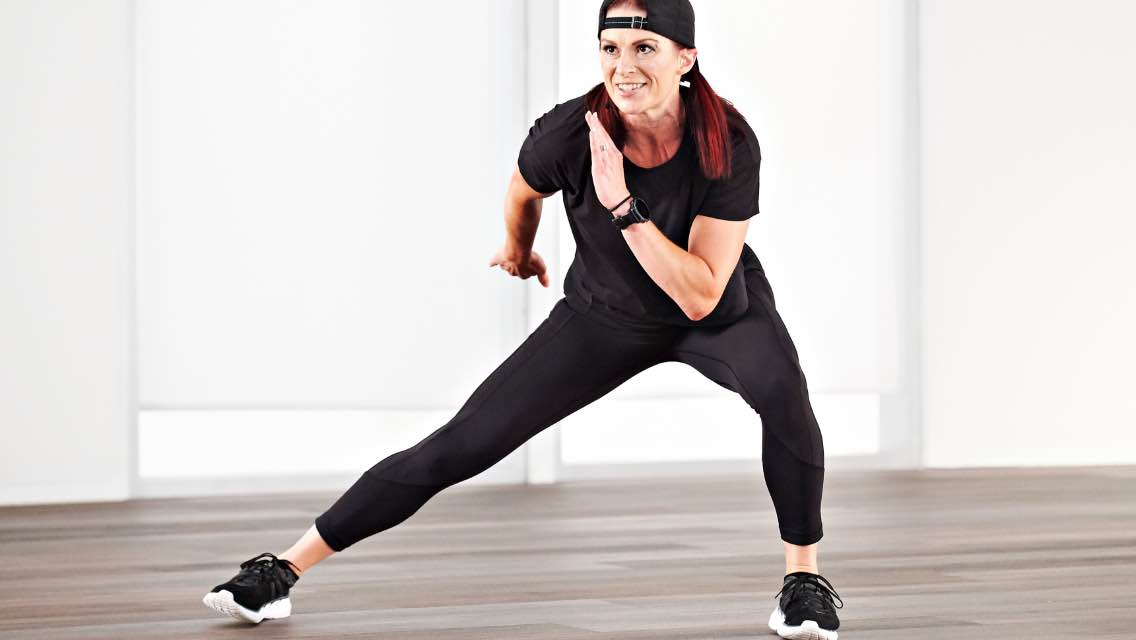 a woman performs an energized side lunge