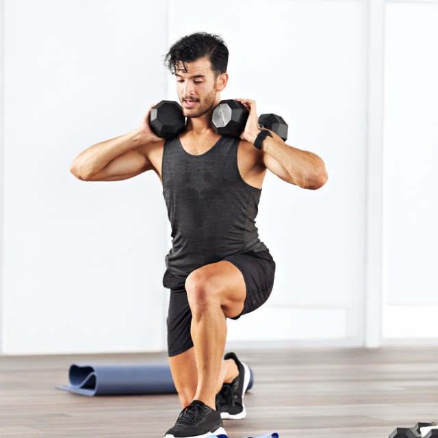 Man taking a Gluteous Maxout class at home with Life Time Classes On Demand