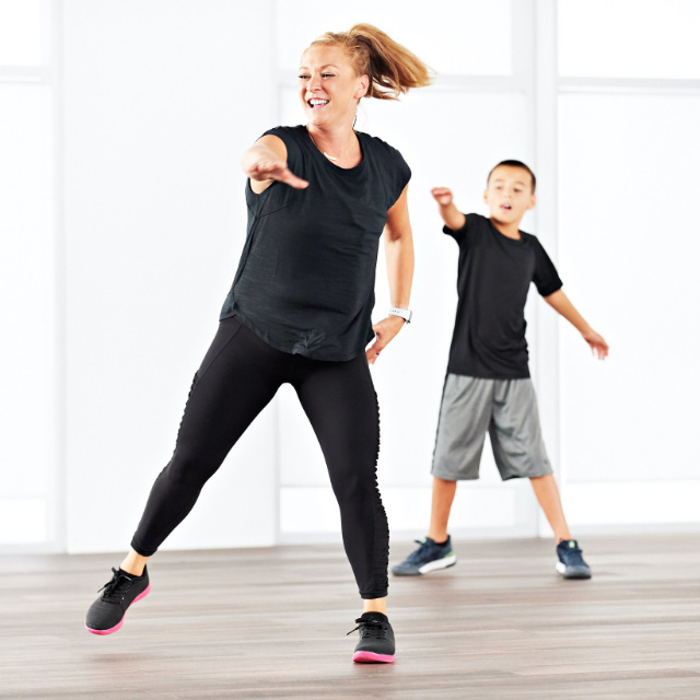 A family taking a family shred class at home with Life Time Classes On Demand