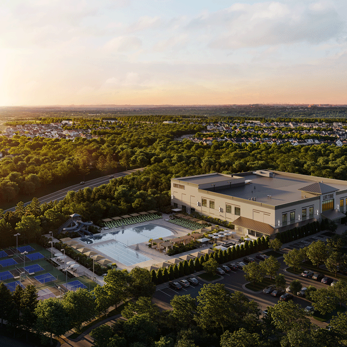 Exterior of a Life Time building with skyscrapers in background.