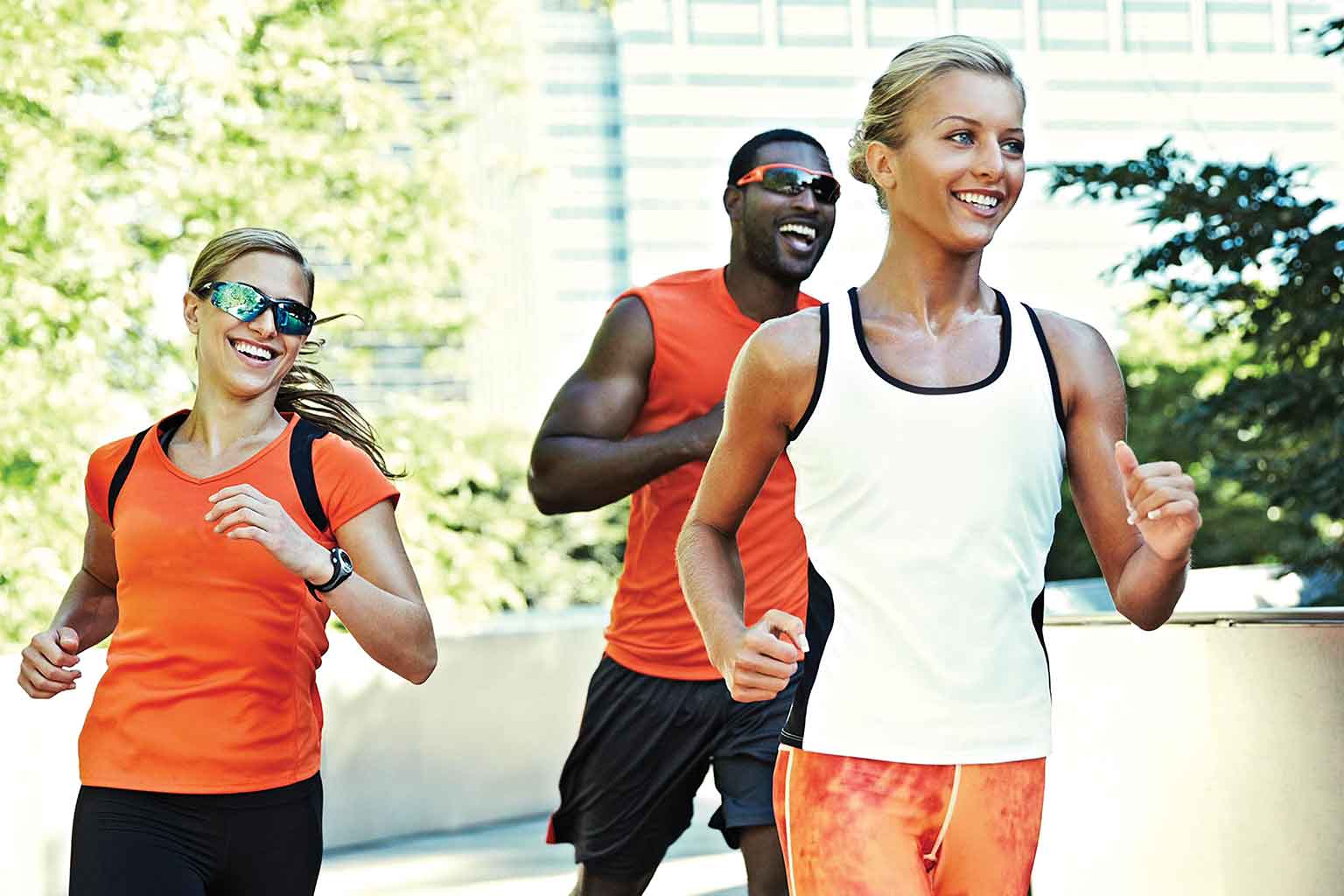 a young athletic woman running and smiling