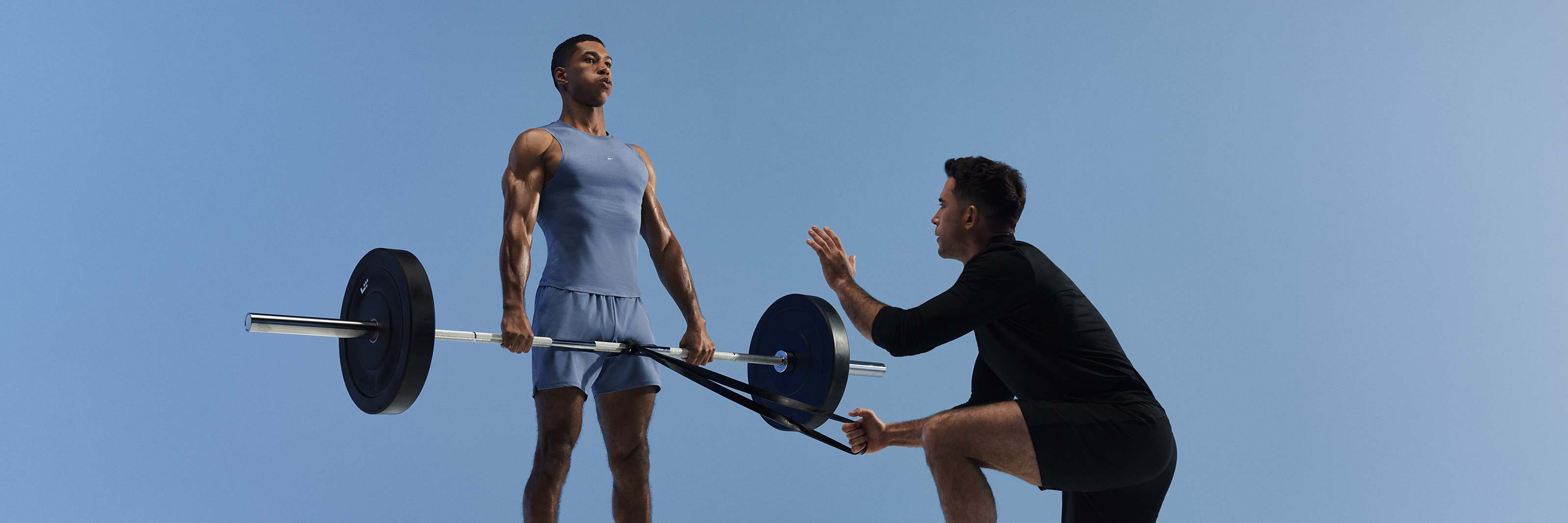 a trainer works with a client